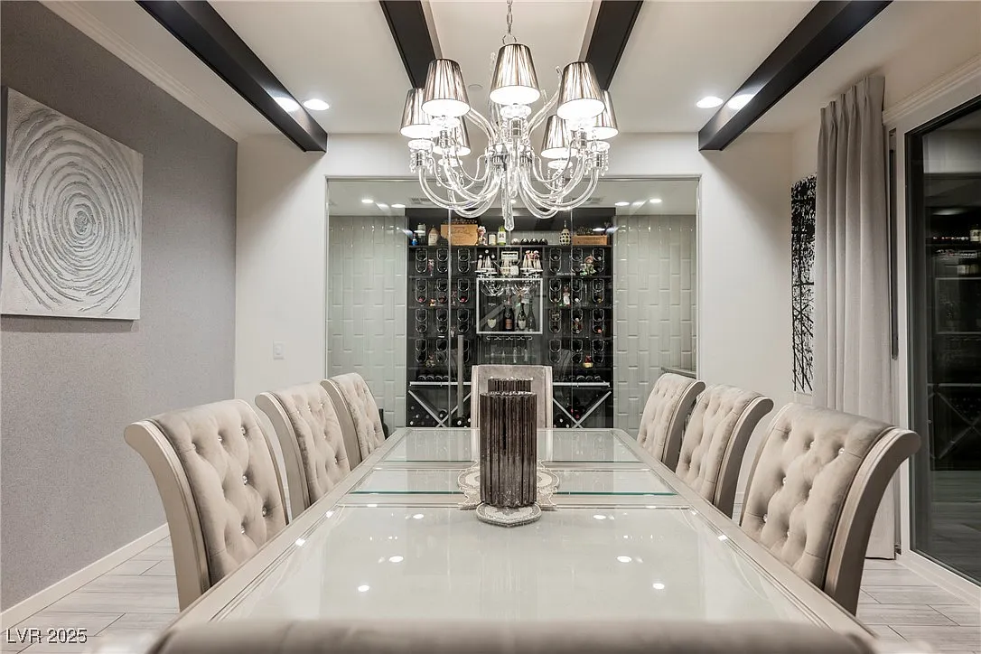 Dining room with chandelier and wine display