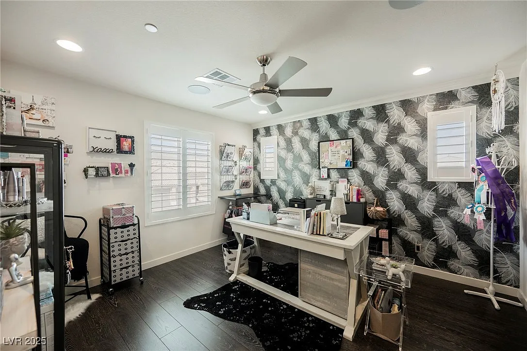 Home office with graphic wallpaper and organized work areas